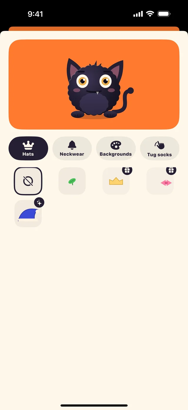 The wardrobe: the gremlin on an orange backdrop above tabs for hats, neckwear, backgrounds and tug socks.